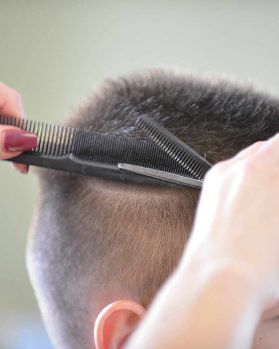 A precision cut in progress at Salon D'Va